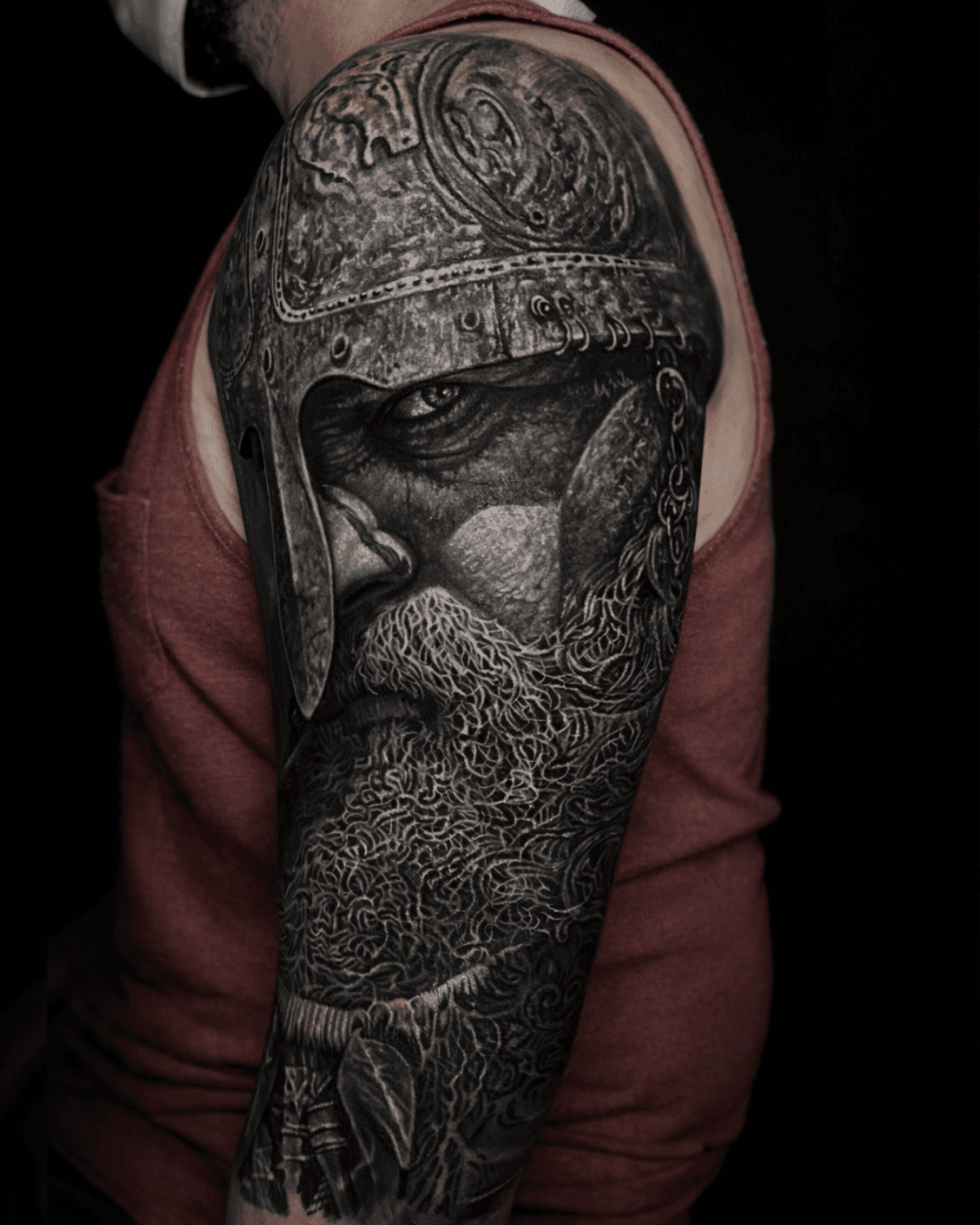 Black and grey Viking cover-up tattoo transformation in Berlin.