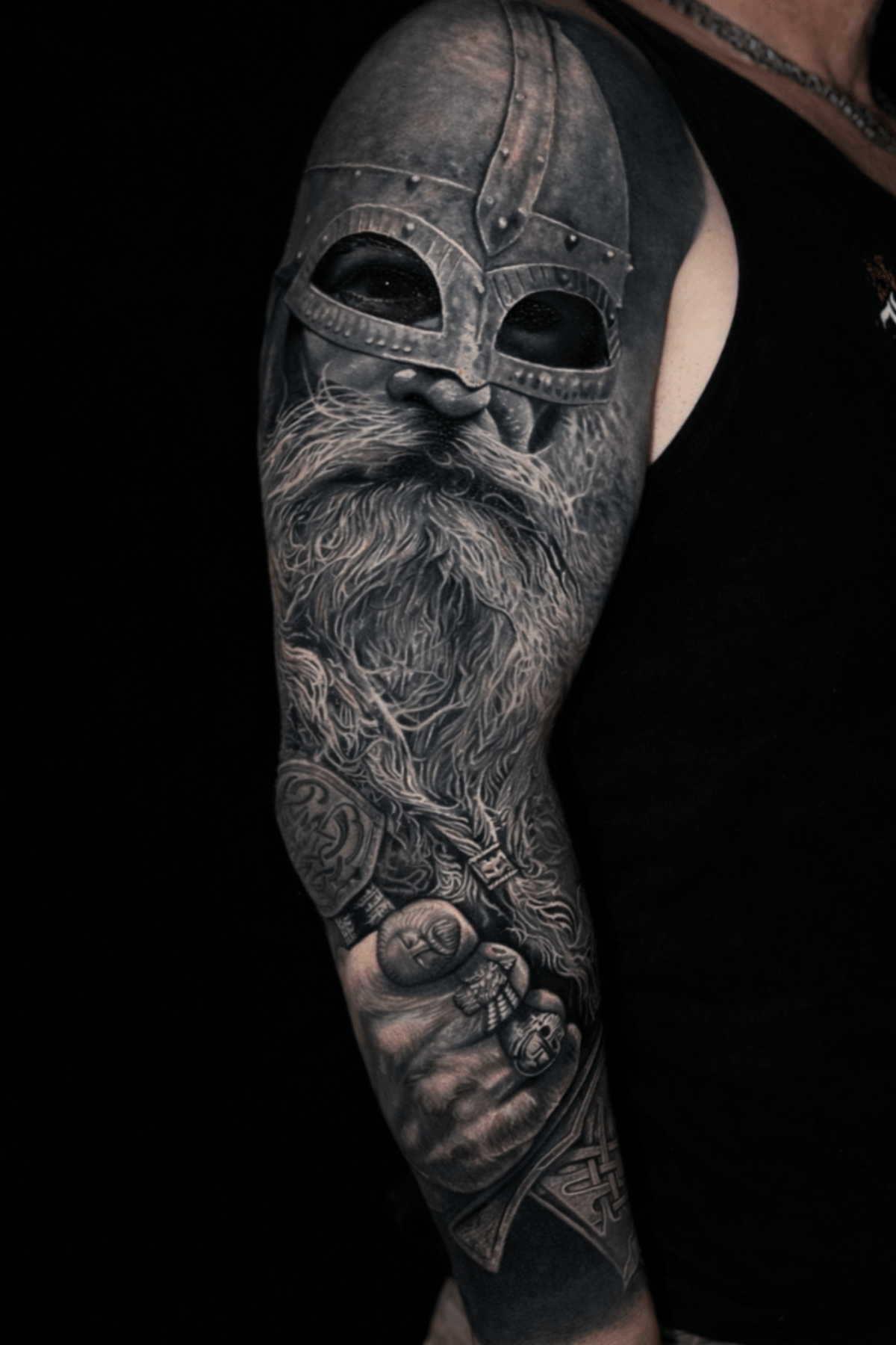 Black and grey Viking tattoo cover-up by Leo Acosta in Berlin